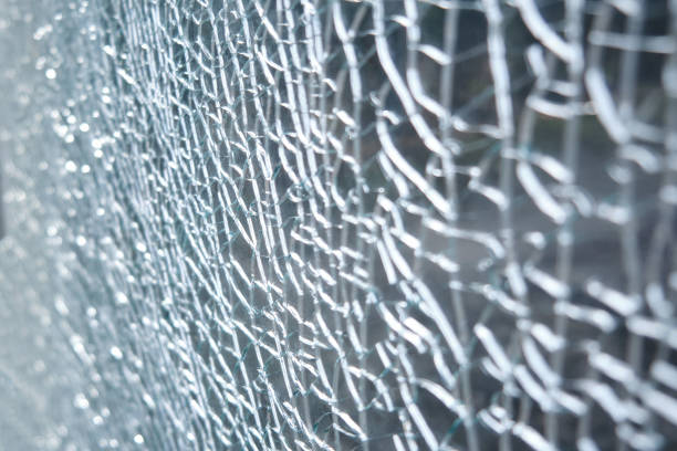 istock Transparent background of cracks on broken glass, texture 1327896654