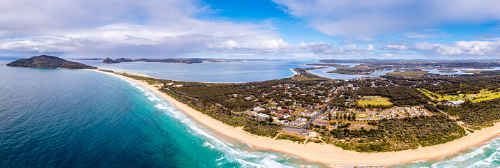 Panoramic Aerial view of the Coastal town of Hawks Nest with Jimmys Beach and Bennetts Beach, Tea Gardens near Port Stephens and Nelson Bay