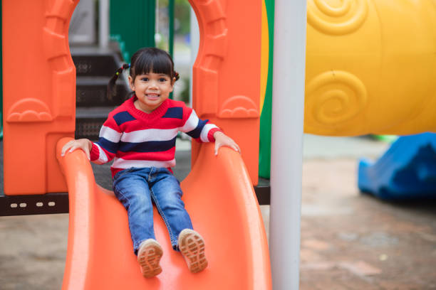 istock Active little girl on playground 1327908688