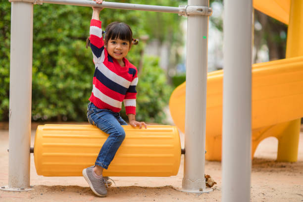 istock Active little girl on playground 1327908716