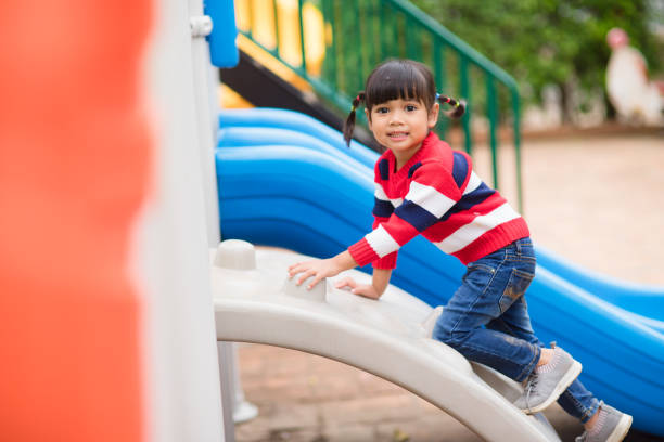 istock Active little girl on playground 1327908729