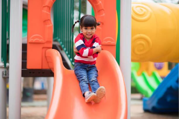 istock Active little girl on playground 1327908745