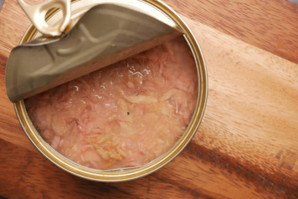 istock canned tuna on wooden table , 1327909286