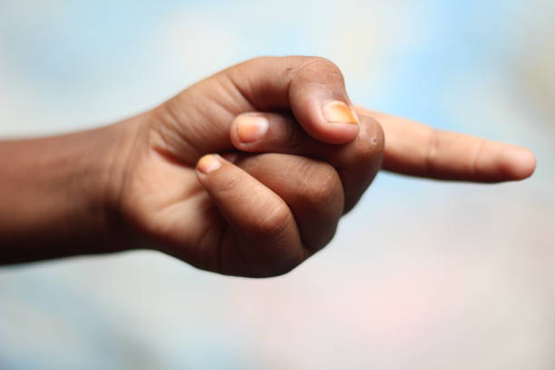 istock A boy is pointing forward with one of his fingers 1327915601
