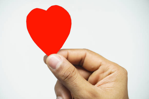 istock heart in hand caring heart concept on white background 1327920728