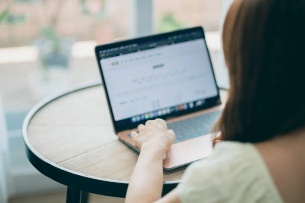 istock Young asian Woman using computer in living room 1327927114
