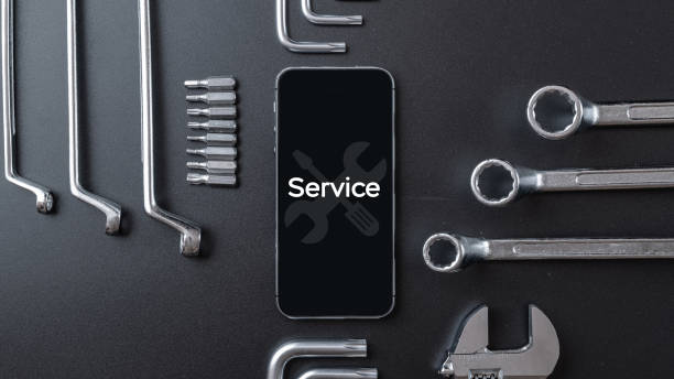 istock Phone repair technician. Technician workplace with phone and special repairing tools. Computer hardware, electronic repairing and upgrade technology concept. 1327931908