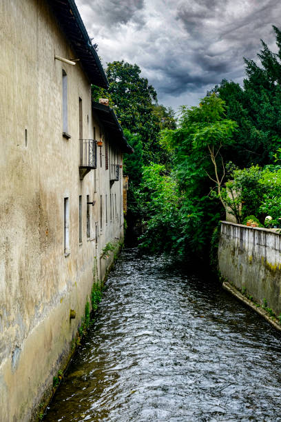 istock old neighborhood with water canal 1327932695