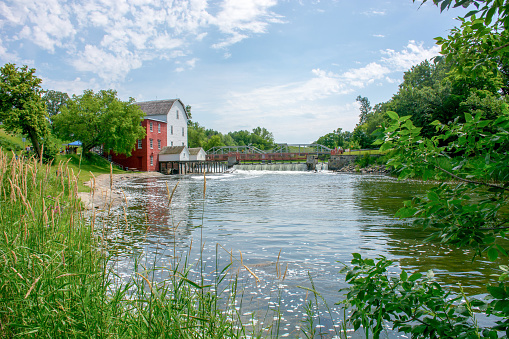 Clinton, USA - October 29, 2023. The Red Mill Museum and waterfalls at Raritan River, Clinton, New Jersey, USA