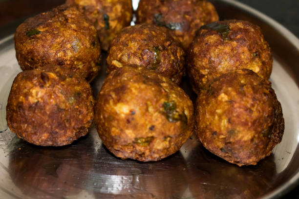 Indian Vegetarian koftas made with bottle gourd and gram flour as a main ingredients with onion, coriander leaf other ready for frying. stock photo