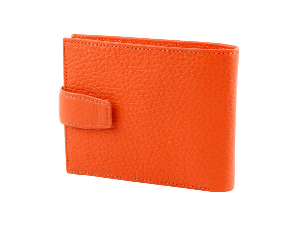 New orange wallet of genuine cattle leather. Isolated on white New orange wallet of genuine cattle leather. Isolated on white background. Close-up shot leather pocket clothing hide stock pictures, royalty-free photos & images