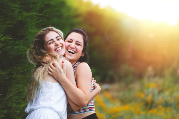 istock best girlfriend hugs and smiles 1327939762