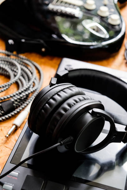 istock Guitar and music studio equipment 1327939956
