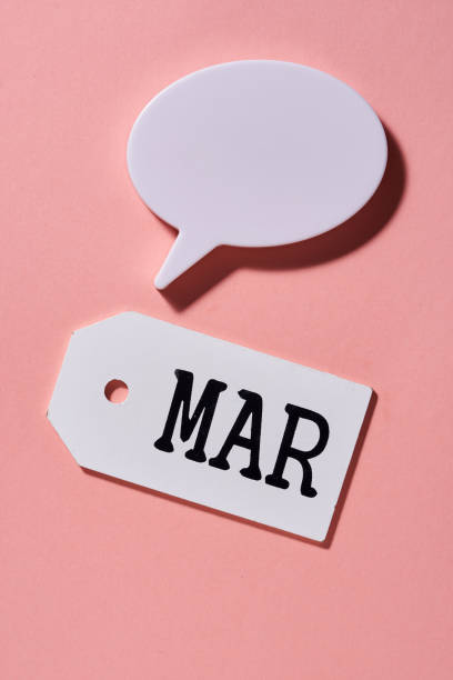 istock wood tag with text March and speech bubble for copy space 1327942292