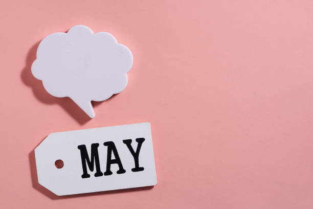 istock wood tag with text May and speech bubble for copy space 1327942343