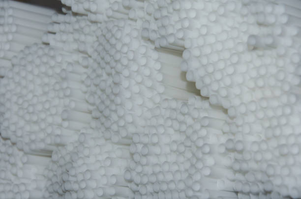istock Close - up on the background of white plastic pipes, tubes, selective focus 1327946026