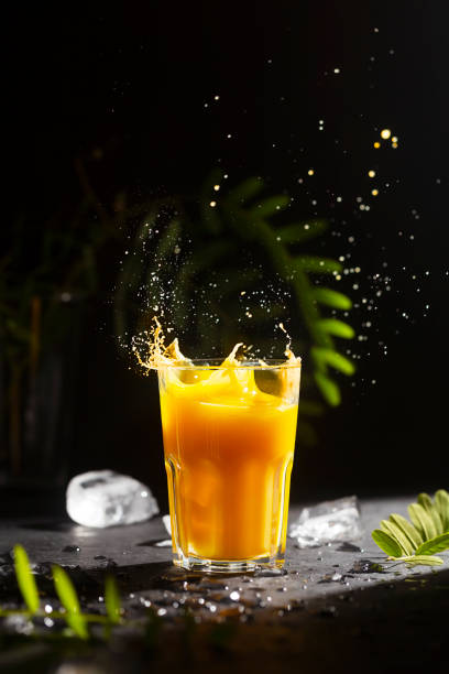 istock Orange colored citrus soft drink with ice and green leaves 1327950154