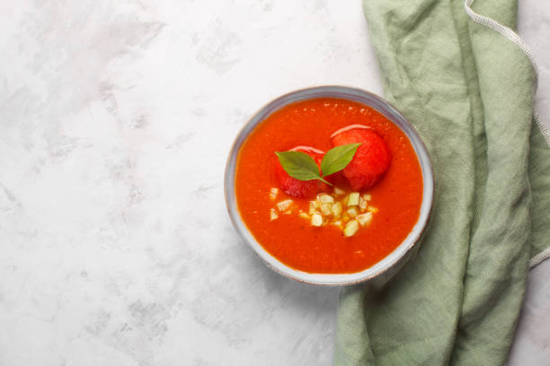 istock Plate with cold soup in the form of mashed gazpacho in a plate on a gray background 1327950165