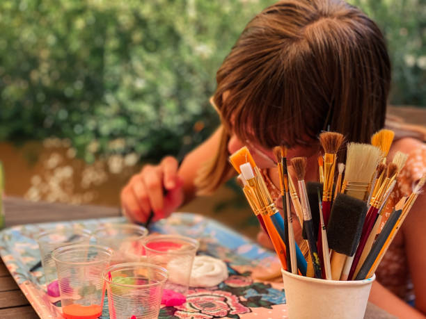 istock Girl doing crafts at home 1327952174