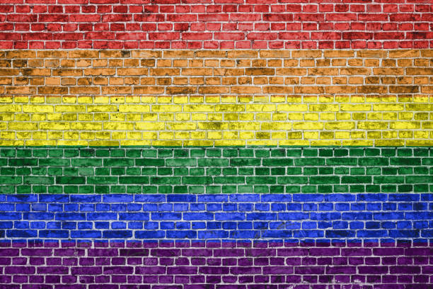 istock Brick wall painted in rainbow colours 1327953257