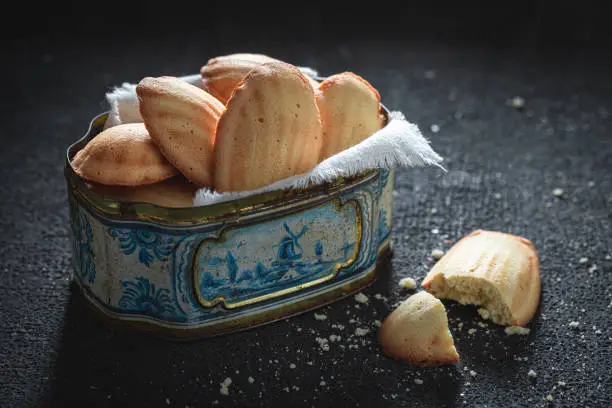 Traditionally Madeleine cookies made from basic ingredients. Classic French cuisine. Traditional French cuisine.