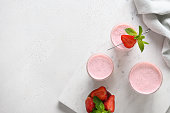 Indian strawberry lassi or milkshake on white background
