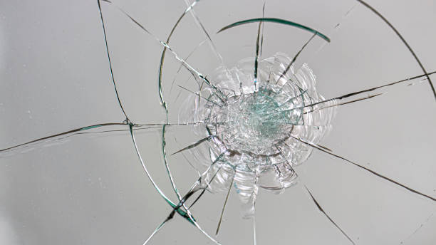 istock Cracks on the glass on a white background. 1327957577