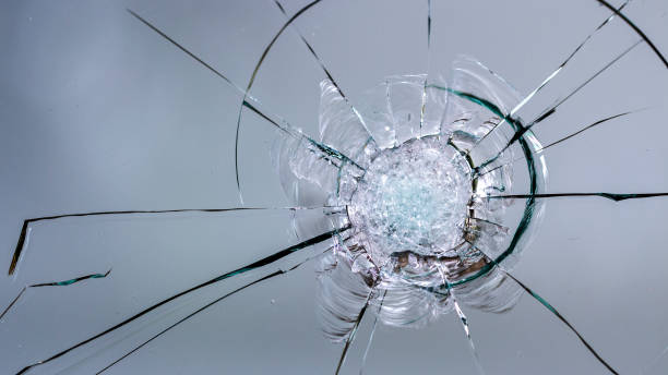 istock Cracks on the glass on a white background. 1327957580