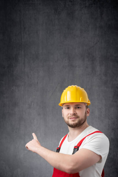 istock Worker pointing his finger at the wall 1327957951