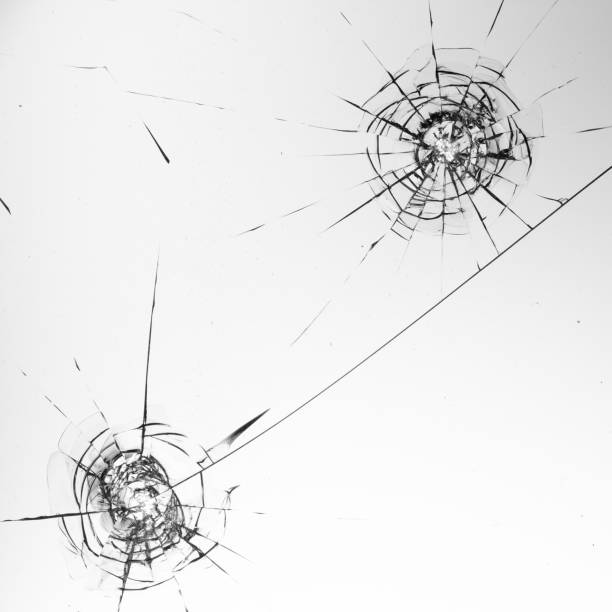 istock Cracks on the glass on a white background. 1327958160