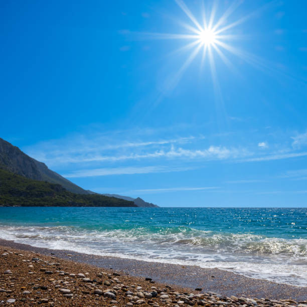 emerald sea with sandy beach at the sunny day