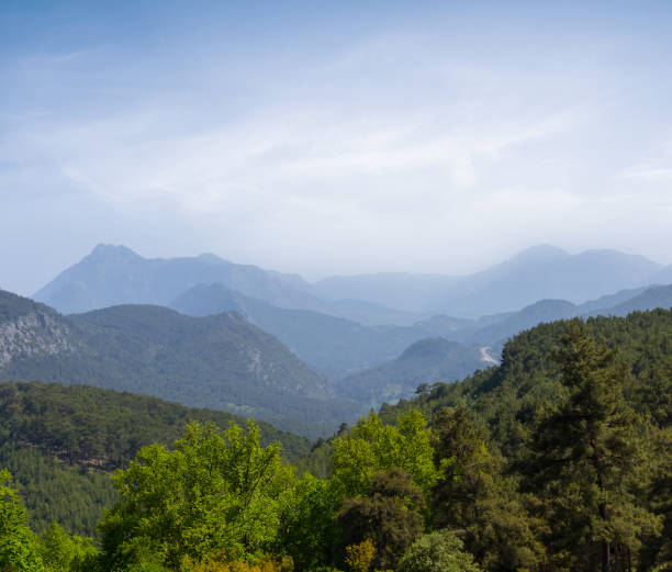 istock green mountain valley in blue mist 1327958213