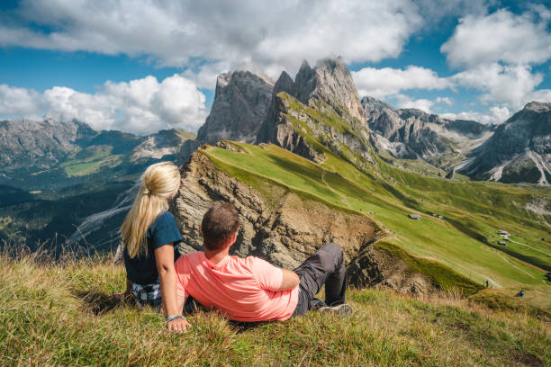 istock A man with backpack enjoy landscape of Seceda peak in Dolomites Alps, Odle mountain range, South Tyrol, Italy, Europe. Travel vacation concept 1327958476