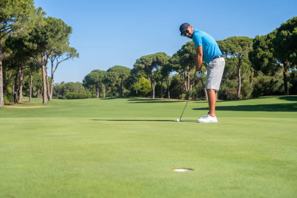 istock Golfer Drive The Ball Into The Hole 1327962140