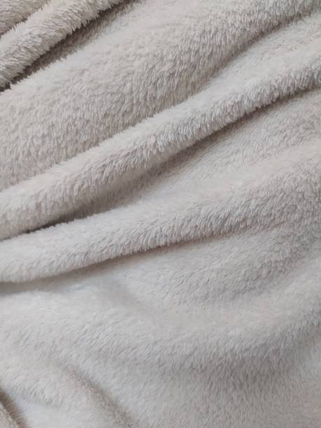 istock Fluffy texture of a white blanket 1327962332