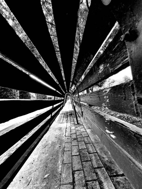 istock Image that simulates tunnel vision in perspective. It is composed of geometric lines that meet at the vanishing point. Black and white background image. 1327962359