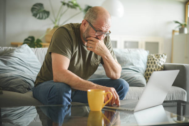 istock mature adult man working from home office ( laptop, negative emotion ) 1327968500