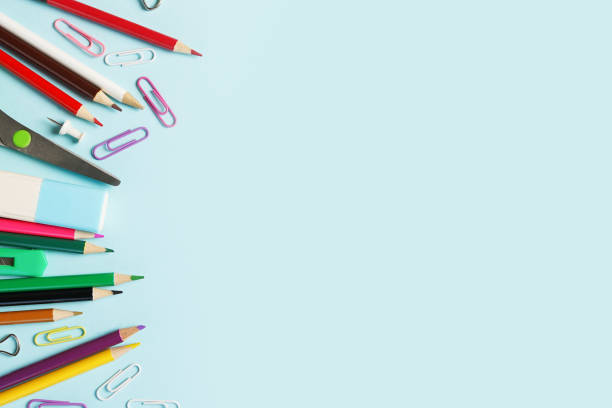 istock School supplies on blue background ready for your design, copy space 1327968687