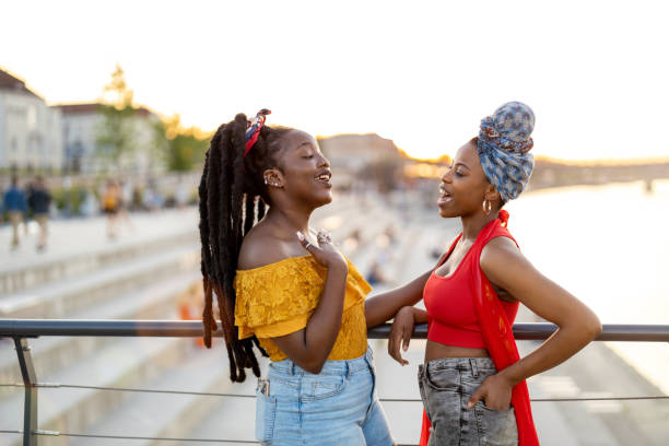 istock Happy young women enjoying the outdoors at sunset 1327972967