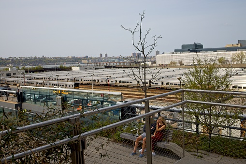 New York, NY, USA - July 10, 2021: LIRR trains in Hudson Yards as viewed from the High Line above West 30th Street