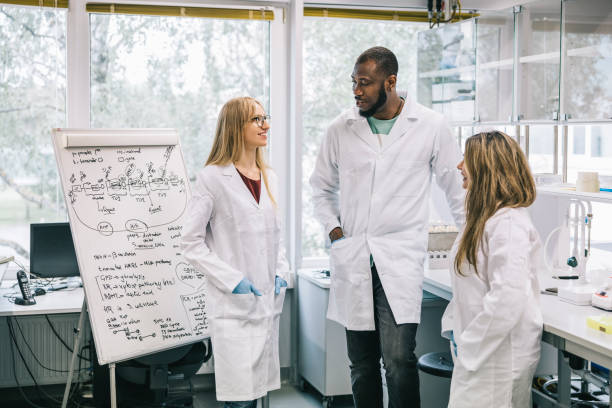 istock Small group of scientists having team meeting 1327977799