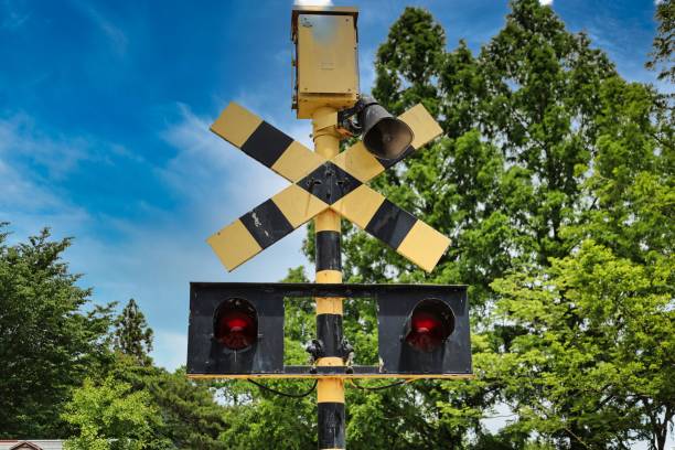 Circuit breaker for blue sky and old railroad crossing stock photo
