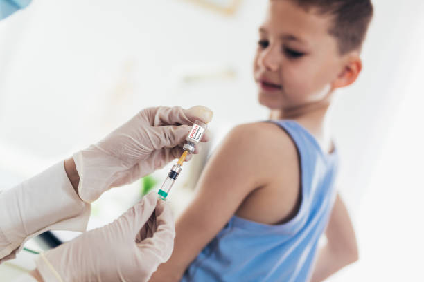 istock Doctor vaccinating child. 1327982972