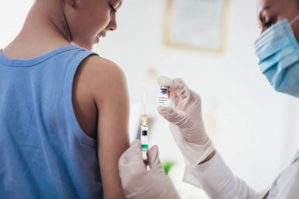 istock Doctor vaccinating child. 1327983093