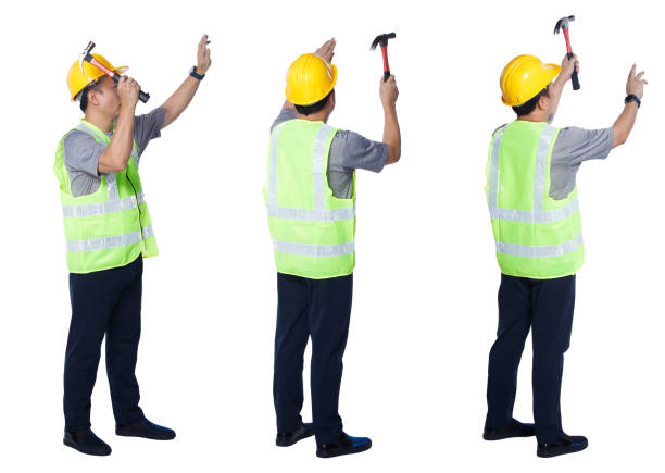 istock Asian Elderly man Engineer labor hit nail with Hammer isolated 1327983384