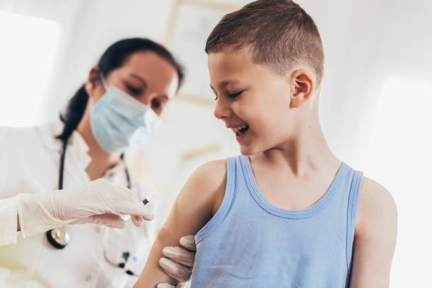 istock Doctor vaccinating child. 1327984420