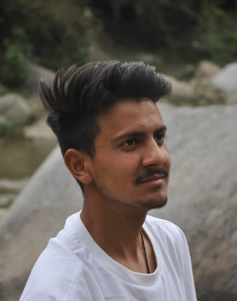 istock A handsome young guy with wearing white tshirt standing beside of river with looking sideways 1327984438