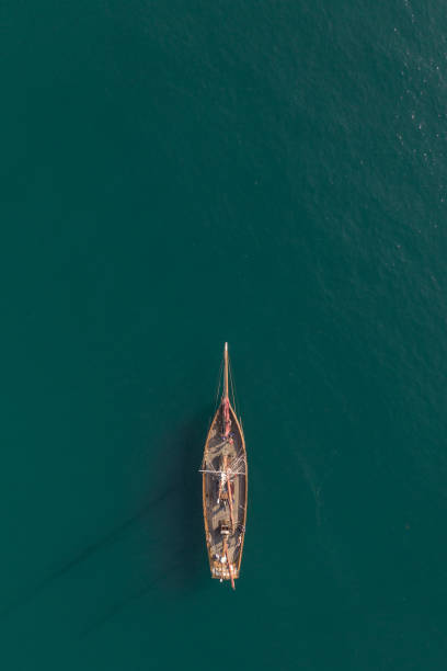 istock Aerial view of a tall ship floating on a turquoise ocean with copy space 1327985899