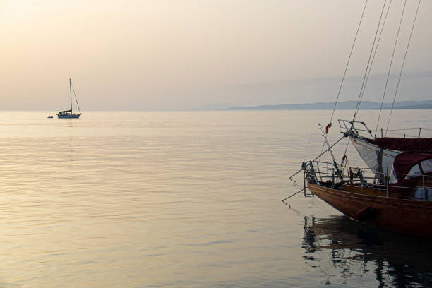istock Sailboats at sunset. View from harbor, Spetses, Greece 1327990601