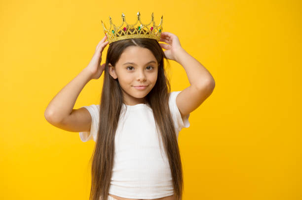 istock Narcissistic complex. Having fun. Self esteem. Kids psychology. Because I am perfect. International childrens day. Superior princess. Playful princess. Schoolgirl princess golden crown. Queen concept 1327992926
